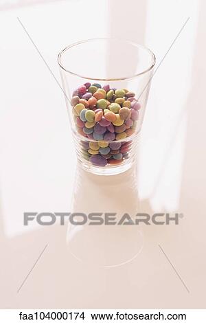 Picture - Colorful candies in glass. Fotosearch
