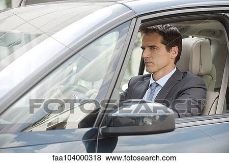 Stock Photo - Commuter driving car. Fotosearch
