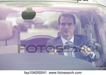 Stock Image - Commuter driving car without passengers. Fotosearch