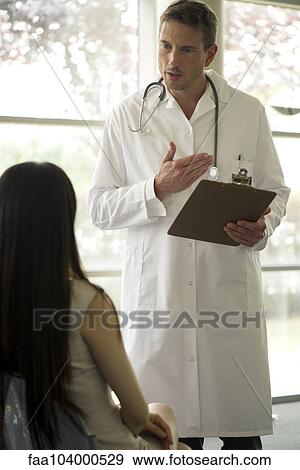Doctor explaining test results to patient View Large Photo Image Stock Photo - Doctor explaining test results to patient. Fotosearch