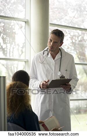 Doctor talking with patient View Large Photo Image Stock Photography - Doctor talking with patient. Fotosearch
