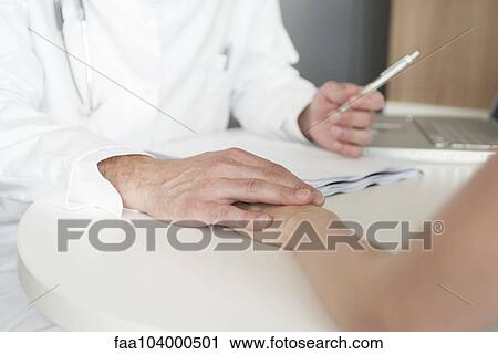 Doctors deliver difficult news to patients with compassion View Large Photo Image Stock Image - Doctors deliver difficult news to patients with compassion. Fotosearch