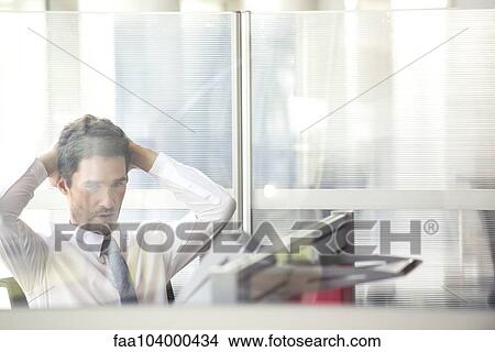 Picture - Exhausted office worker taking break. Fotosearch