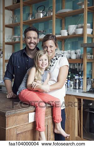 Family at home together in kitchen, portrait View Large Photo Image Picture - Family at home together in kitchen, portrait. Fotosearch