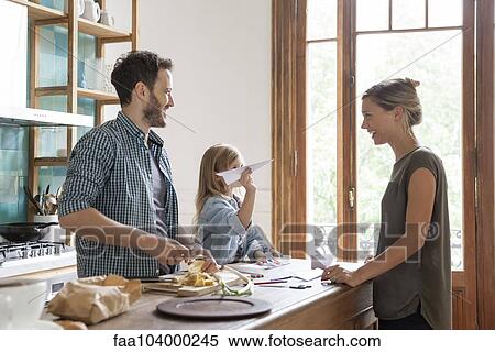 Family spending time together in kitchen View Large Photo Image Stock Photography - Family spending time together in kitchen. Fotosearch