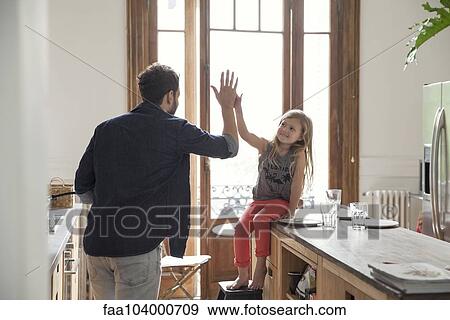 Father and daugther high-five View Large Photo Image Stock Photo - Father and daugther high-five. Fotosearch