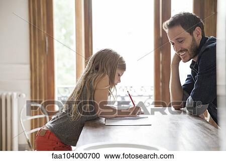 Father helping daughter practice writing View Large Photo Image Stock Image - Father helping daughter practice writing. Fotosearch