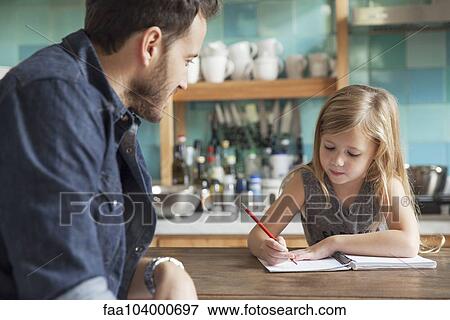 Father helping young daughter with homework View Large Photo Image Stock Photo - Father helping young daughter with homework. Fotosearch