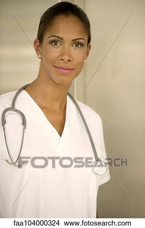 Picture - Female nurse smiling confidently, portrait. Fotosearch