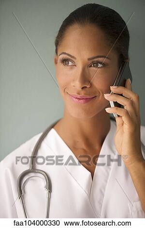 Female nurse using cell phone, portrait View Large Photo Image Stock Image - Female nurse using cell phone, portrait. Fotosearch