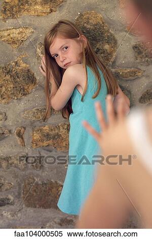 Girl leaning against wall during game of tag View Large Photo Image Stock Photography - Girl leaning against wall during game of tag. Fotosearch