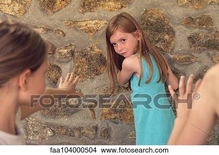 Picture - Girl playing tag with friends. Fotosearch