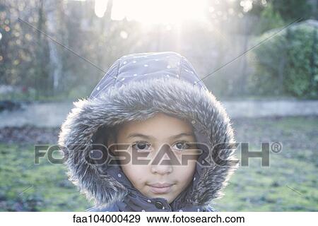 Girl wearing hooded coat, portrait View Large Photo Image Stock Photo - Girl wearing hooded coat, portrait. Fotosearch