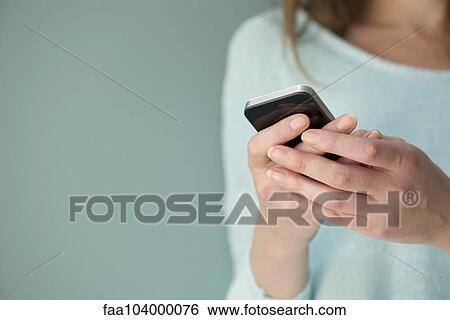 Stock Photograph - Instant messaging with smartphone. Fotosearch