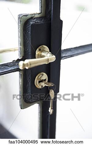 Stock Photography - Key in door lock, close-up. Fotosearch