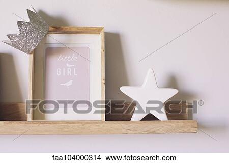 Picture - Knickknacks on shelf in little girl's room. Fotosearch
