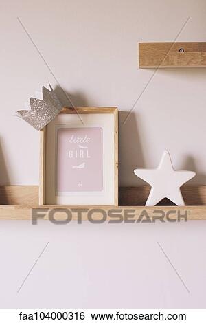 Knickknacks on shelf in little girl's room View Large Photo Image Stock Photograph - Knickknacks on shelf in little girl's room. Fotosearch
