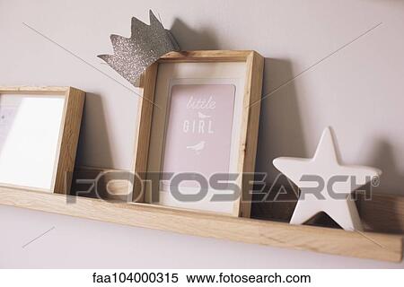 Stock Photography - Knickknacks on shelf in little girl's room. Fotosearch