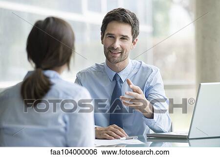 Stock Photograph - Lawyer meeting with client. Fotosearch