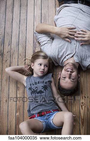 Stock Photography - Little girl and father hanging out together. Fotosearch