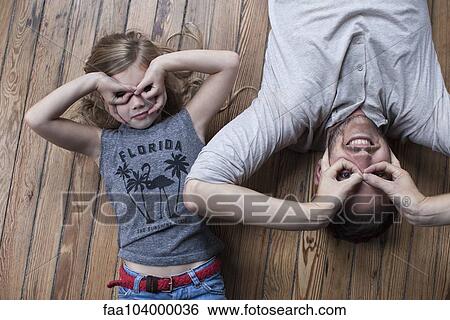 Little girl and father making faces View Large Photo Image Stock Photograph - Little girl and father making faces. Fotosearch