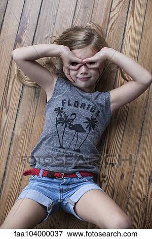 Stock Photo - Little girl making faces. Fotosearch