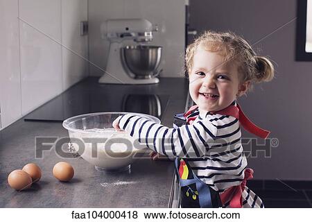 Little girl mixing batter, smiling, portrait View Large Photo Image Stock Photo - Little girl mixing batter, smiling, portrait. Fotosearch
