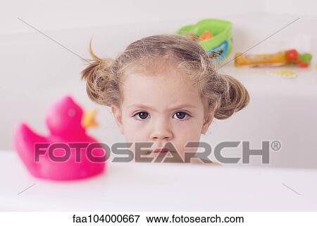 Little girl sitting in bath with unhappy expression, portrait View Large Photo Image Stock Photo - Little girl sitting in bath with unhappy expression, portrait. Fotosearch
