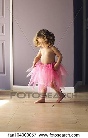 Stock Photo - Little girl wearing pink tutu. Fotosearch