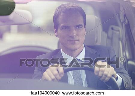 Stock Image - Man driving car. Fotosearch