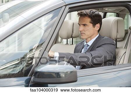 Stock Photo - Man driving car. Fotosearch