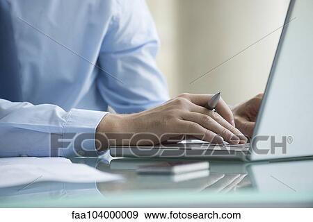 Man using laptop computer View Large Photo Image Stock Photo - Man using laptop computer. Fotosearch