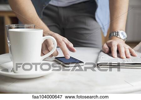 Man using smartphone View Large Photo Image Stock Photo - Man using smartphone. Fotosearch