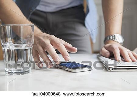 Man using smartphone View Large Photo Image Stock Photo - Man using smartphone. Fotosearch