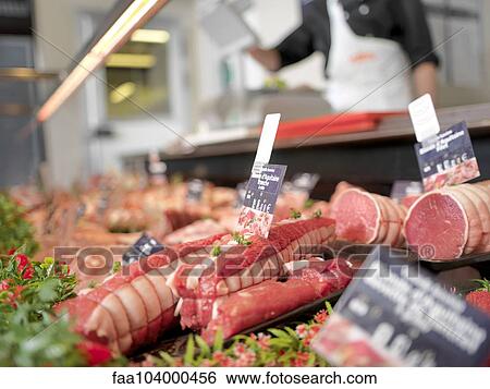 Stock Photograph - Meat for sale in display case. Fotosearch