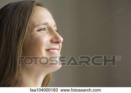 Stock Image - Mid-adult woman, portrait. Fotosearch