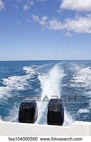 Stock Image - Motor boat and wake. Fotosearch