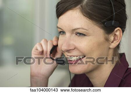Stock Image - Operator on phone call. Fotosearch
