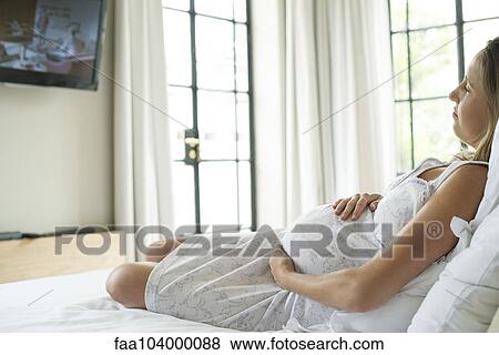 Pregnant woman napping View Large Photo Image Stock Photo - Pregnant woman napping. Fotosearch