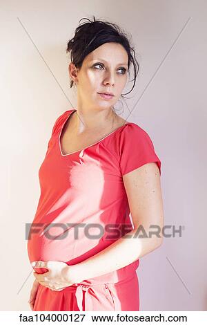 Stock Photo - Pregnant woman, portrait. Fotosearch