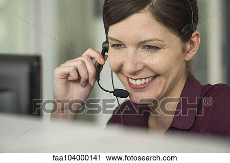 Receptionist at work, portrait View Large Photo Image Stock Image - Receptionist at work, portrait. Fotosearch