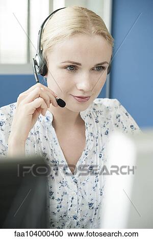Receptionist on phone call View Large Photo Image Stock Image - Receptionist on phone call. Fotosearch