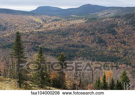 Stock Photo - Rolling landscape with mountains in the distance. Fotosearch