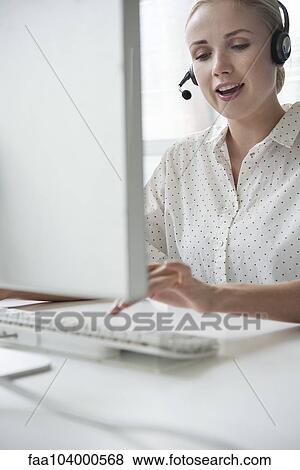 Stock Photo - Saleswoman on telemarketing call. Fotosearch