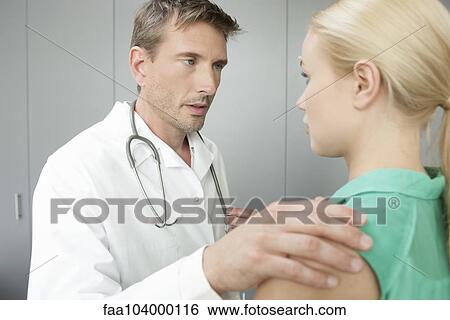 Stock Photograph - Sexual harrassment in healthcare workplace. Fotosearch