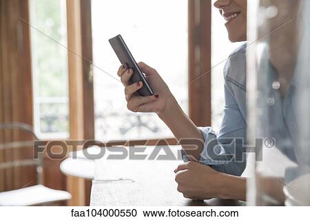 Silhouette of woman using cell phone View Large Photo Image Stock Image - Silhouette of woman using cell phone. Fotosearch