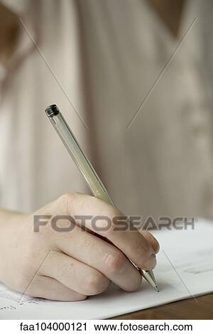 Stock Image - Student doing homework. Fotosearch