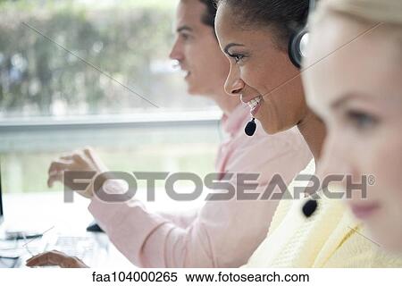 Stock Photography - Telemarketers working in call center. Fotosearch