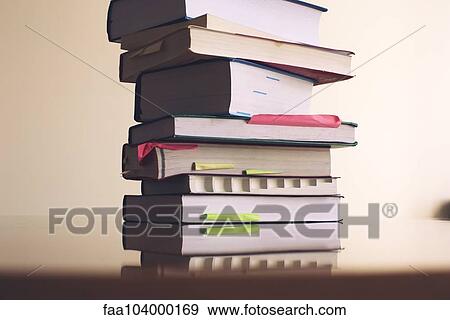 Stock Photo - Textbooks stacked on table. Fotosearch