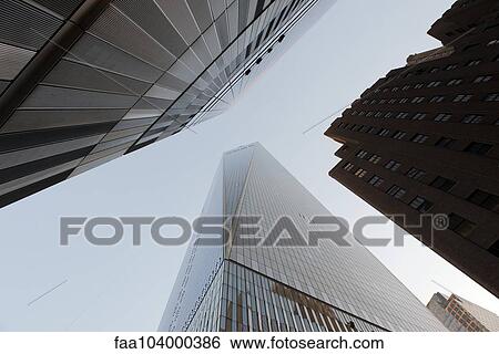 Towering skyscrapers viewed from directly below View Large Photo Image Stock Photograph - Towering skyscrapers viewed from directly below. Fotosearch